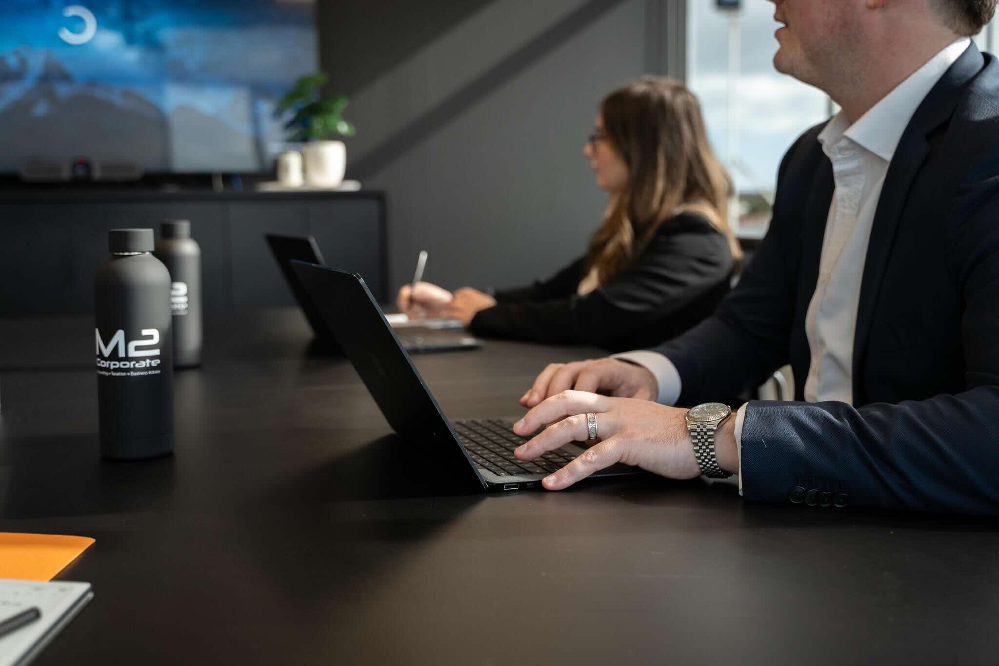 Team of business advisors and business accountants at a meeting table